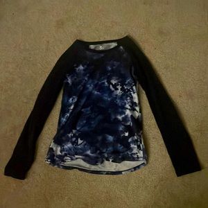 A kids long sleeve shirt.